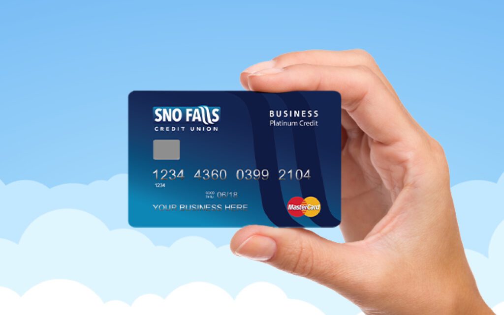 Hand holding a Sno Falls business credit card