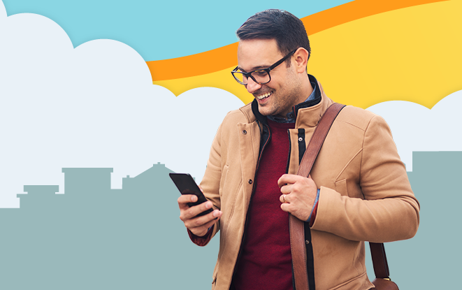 Man smiling at his phone in front of illustrated skyline at sunset