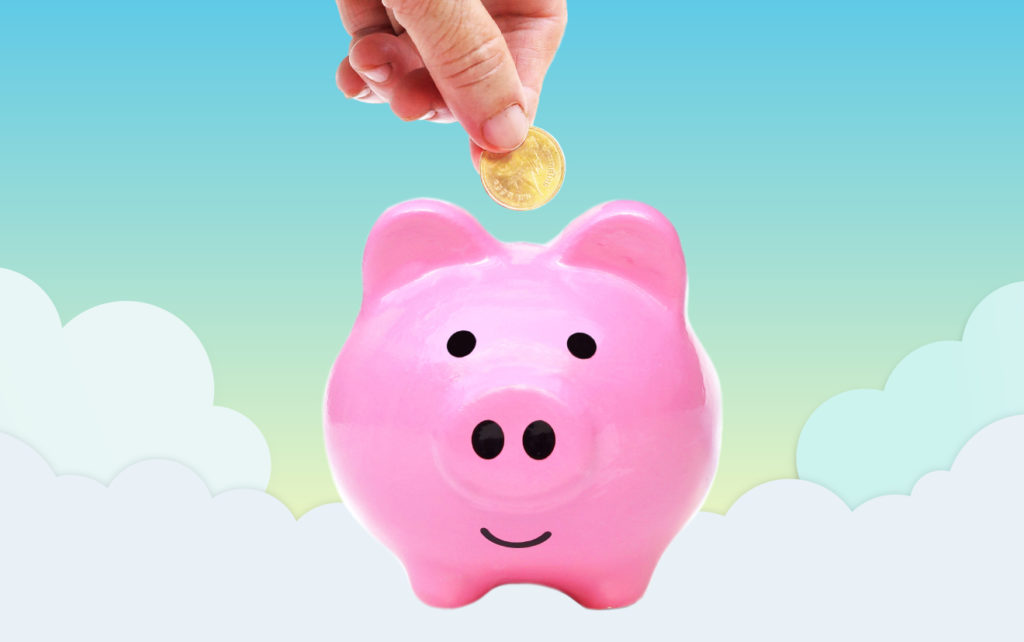 Coin being deposited into piggy bank with cloud background