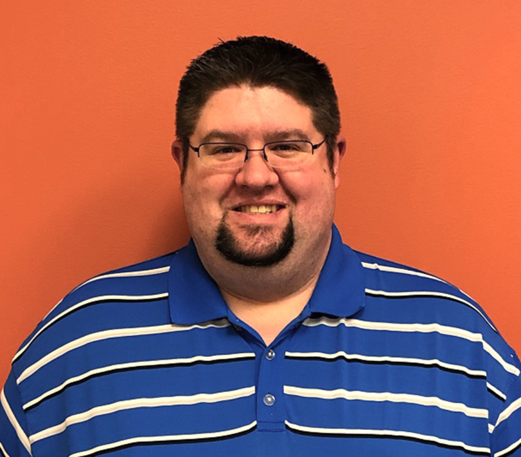 Doug Taylor in front of orange wall