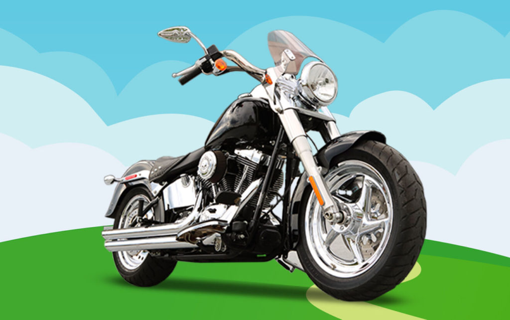 Classic motorcycle parked on a grassy hill